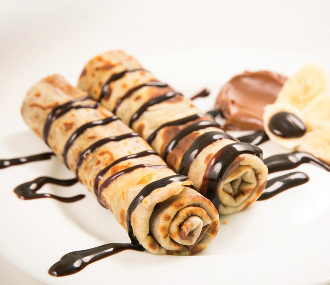 crepes with ice cream, chocolate and cream