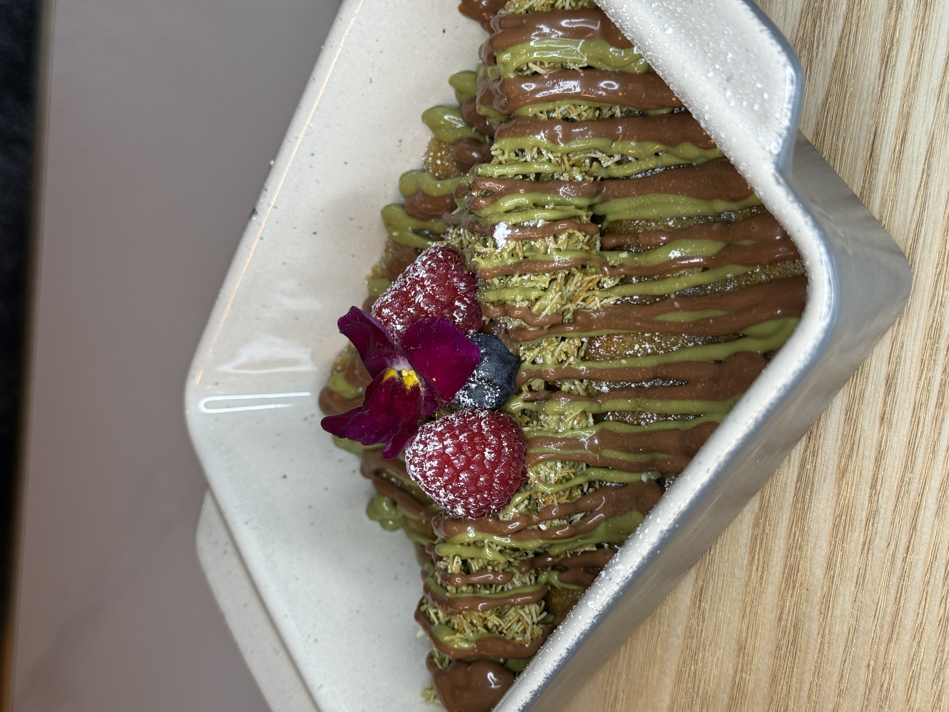 Luxury pistachio cookie dough served warm with rich sauces