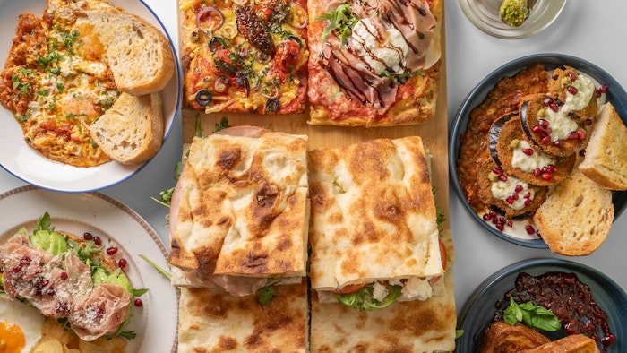 A spread of fresh, locally-sourced Italian specialties from Al Taglio Pizza Edinburgh, including Roman-style pizza and artisanal breakfast options.