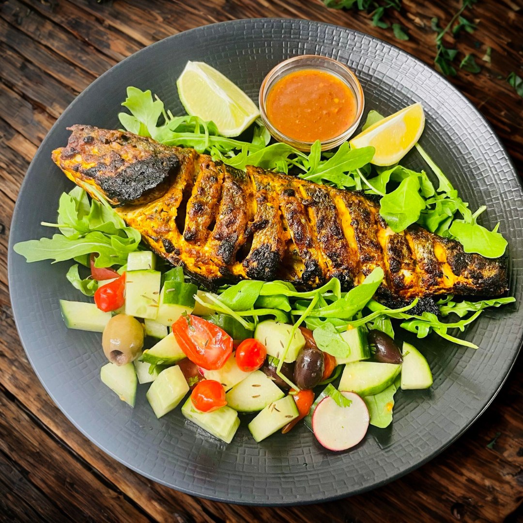 Tandoori Seabass, served with fresh salad mix and Tajdar special sauce.