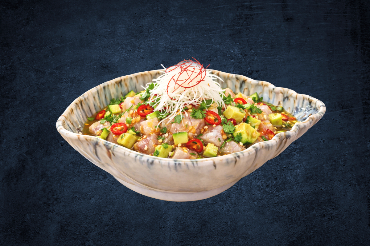 Fresh Hamachi Ceviche tossed in zesty citrus, with avocado, chili, and herbs for a bright, refreshing flavor.