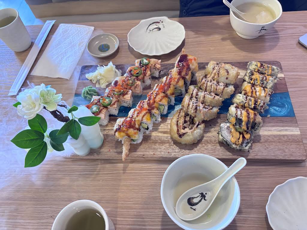 A large assortment of sushi rolls shared at Guildford Sushi House