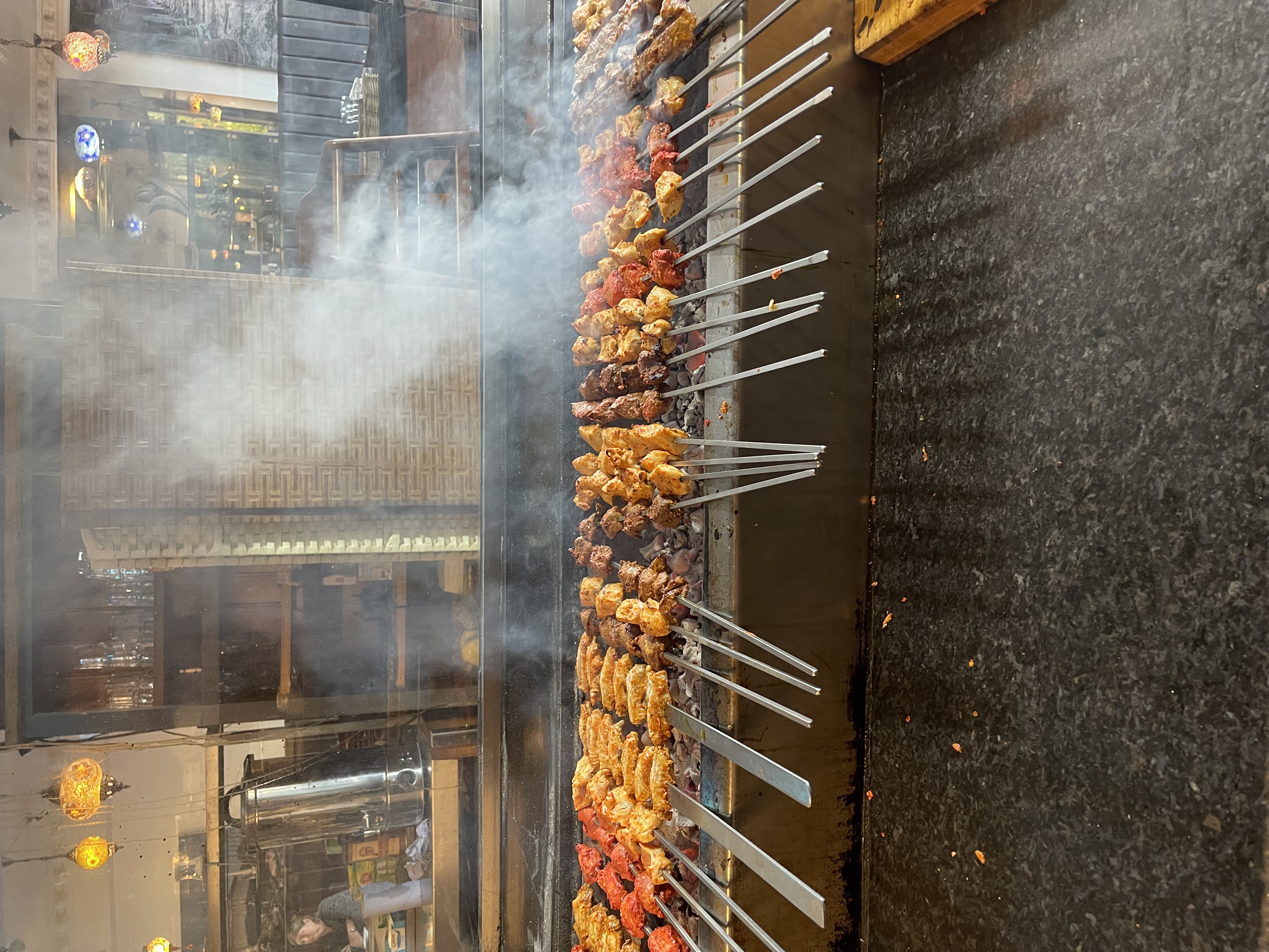 Fresh Turkish kebabs sizzling on the charcoal grill at Antalya Turkish Kitchen Leicester.