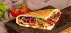 Classic Kebab Deliciously seasoned meat of your choice served with fresh Turkish sesame flat bread with onion, red cabbage, fresh lettuce, juicy tomato, cucumber with our four signature sauces.  Signature Sauces: Red Garlic, Garlic Mayo, Yogurt, Spicy Dip.