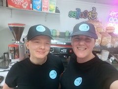 Photo of the team, owner, Lisa and team member Caoimhe.