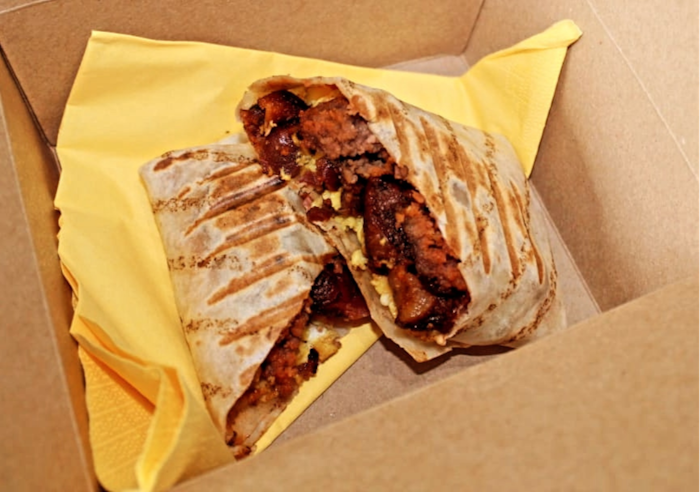 Breakfast Burrito, scrambled egg, bacon, sausage, black and white pudding and relish toasted in a wrap.